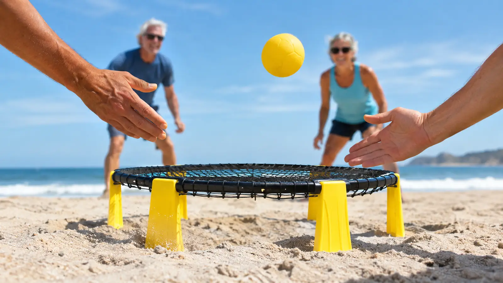 A ball bouncing off the taut net of the round net game on the sand